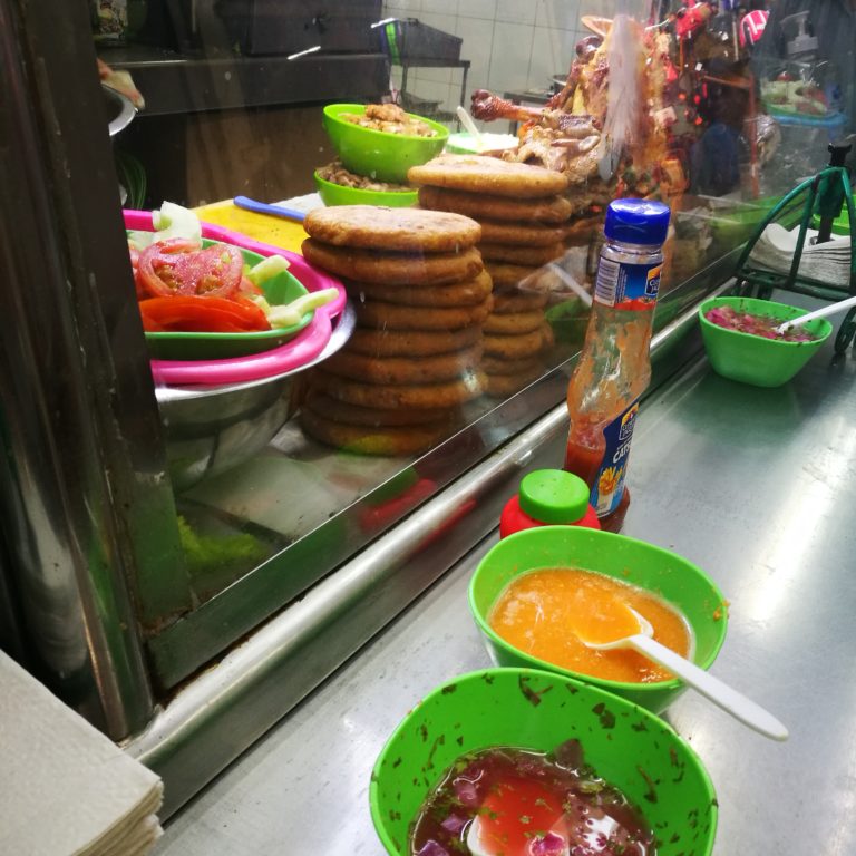 Food stall with salsas and tortillas at Mérida's market